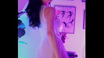 sexy brunette dancing wearing see through white