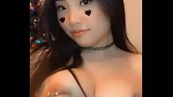 Cute asian teen showing off her pierced nipples